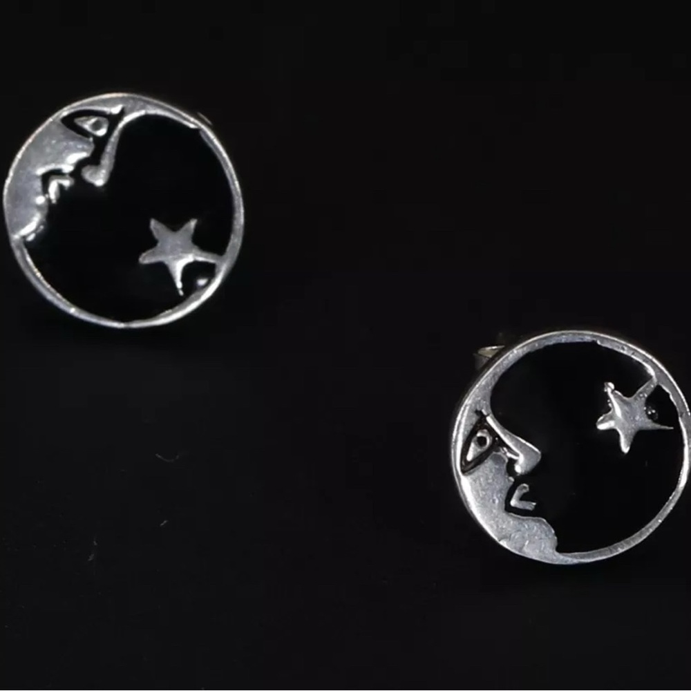 Solid silver man in the moon earrings.
